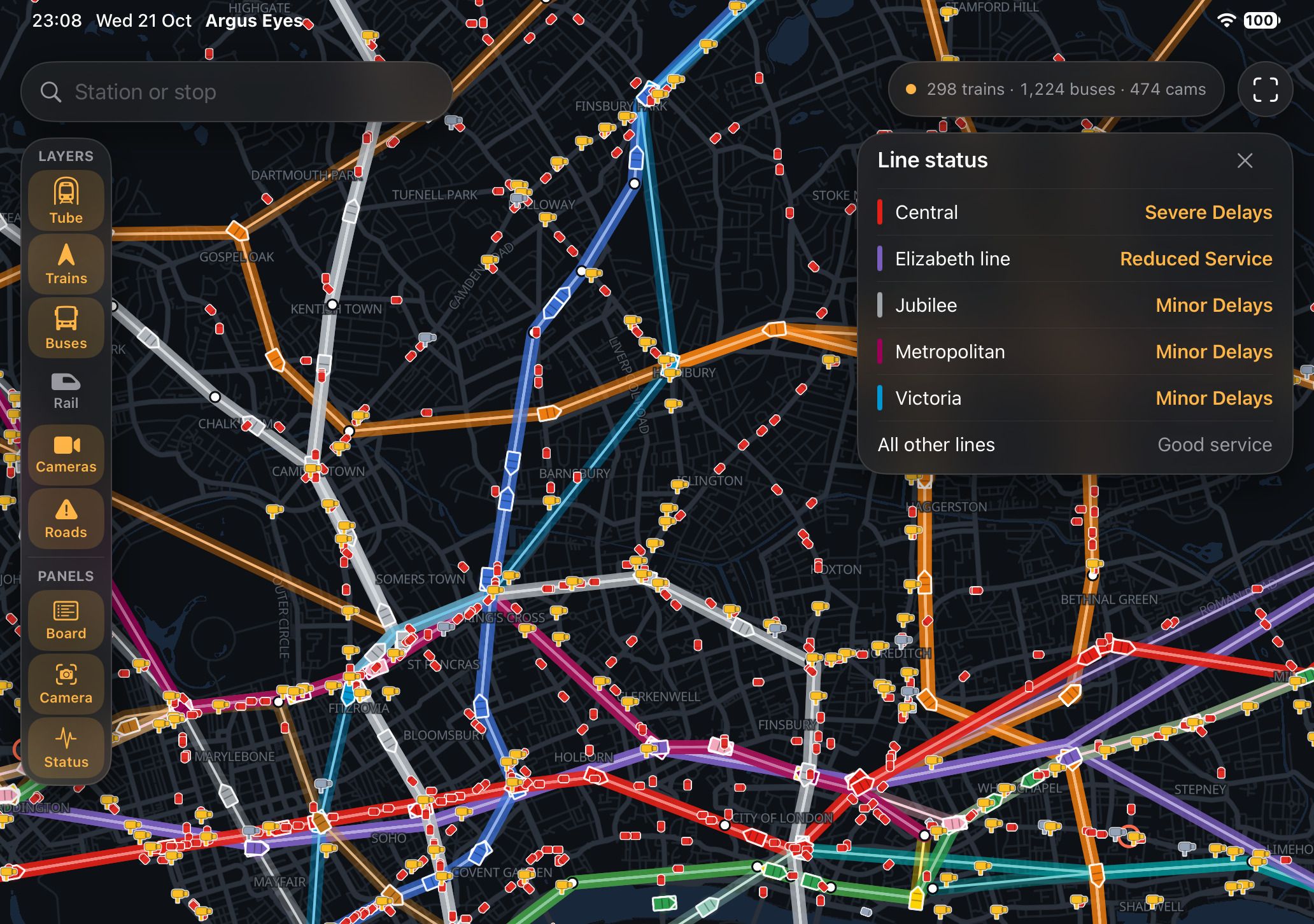 Argus Eyes open: a live map of central London with every train and bus, a layers sidebar and a line status panel showing delays
